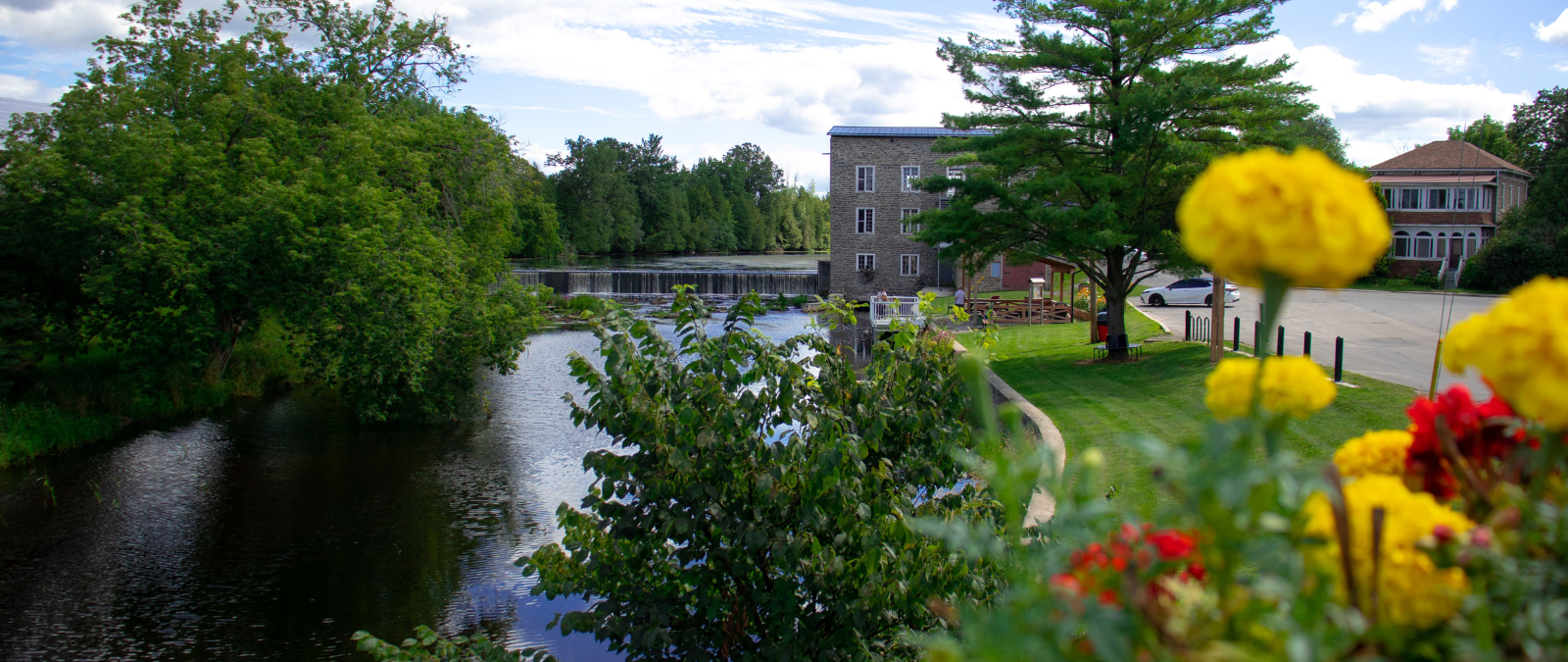 Image overlooking Spencerville Mill from the bridge with a view of the flower pot 